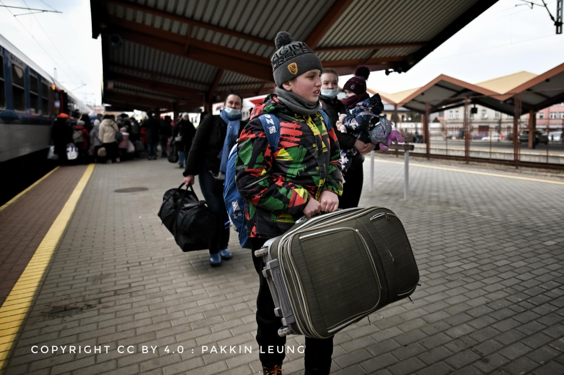 Refugees boarding a train to Warsaw
